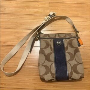 Coach crossbody bag. Classic Coach print with Navy details.